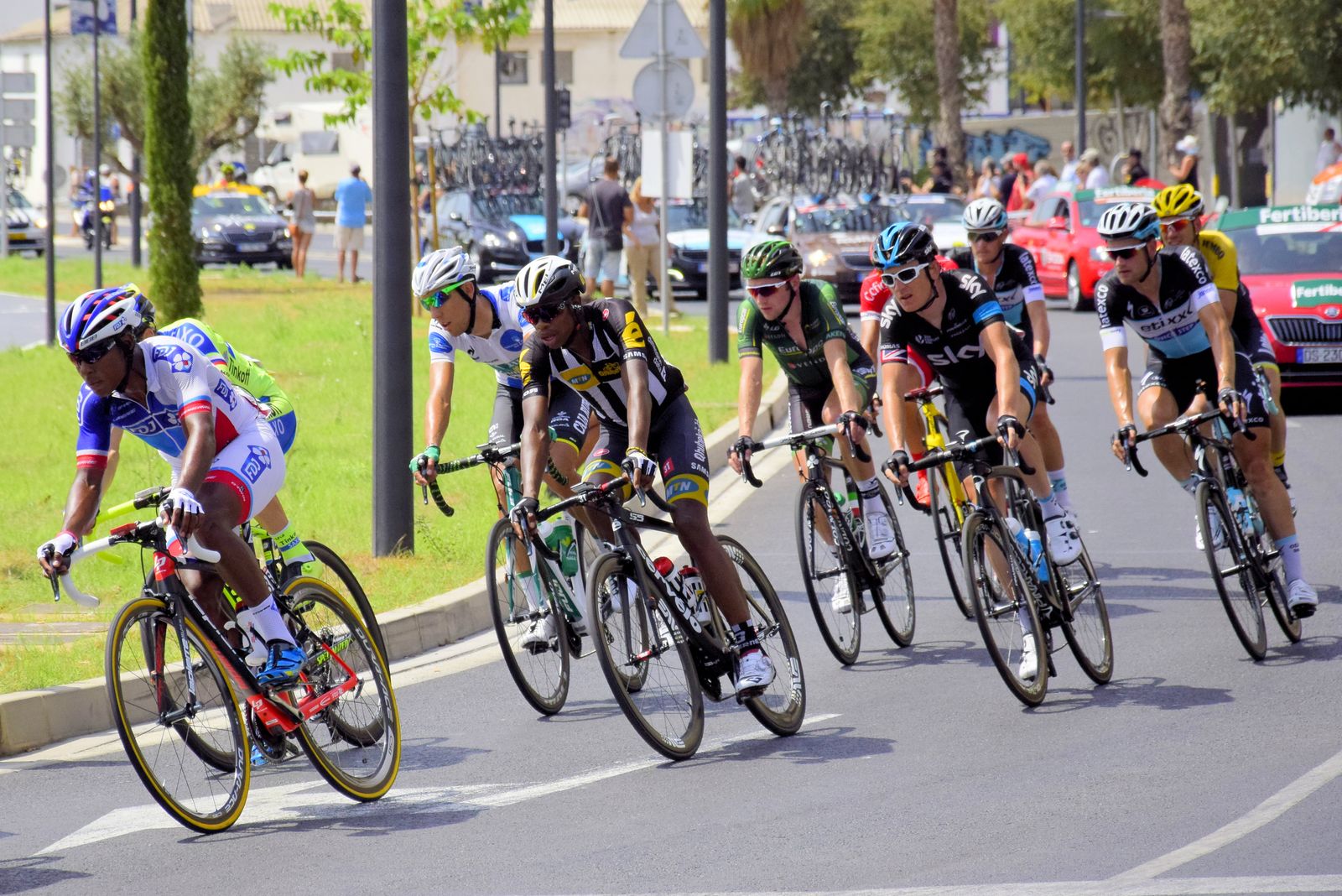 Cyclists racing through city streets during an event